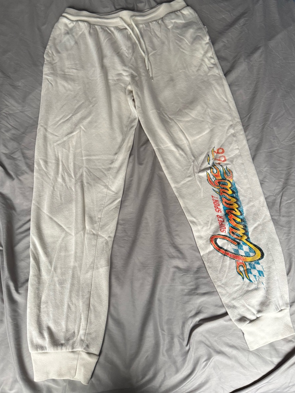 Light tan Sweatpants with Colorful Side Script